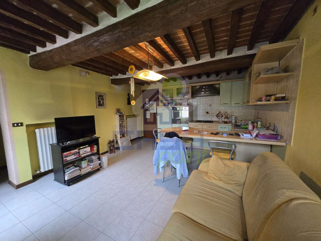 sala con cucina a vista