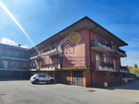 BILOCALE IN ZONA RESIDENZIALE CON AMPIE BALCONATE, CANTINA ED AUTORIMESSA