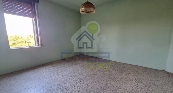 Porzione di casa con orto