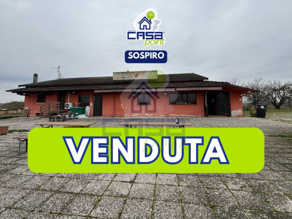 LOCALE COMMERCIALE CON ABITAZIONE ED AMPIA AREA PARCHEGGIO
