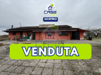 LOCALE COMMERCIALE CON ABITAZIONE ED AMPIA AREA PARCHEGGIO
