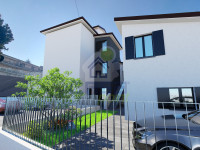 AMPIO BILOCALE DI NUOVA COSTRUZIONE CON GIARDINO PRIVATO, GARAGE E CANTINA