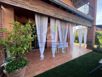 ESCLUSIVO TRILOCALE CON GIARDINO PRIVATO IN CORTE